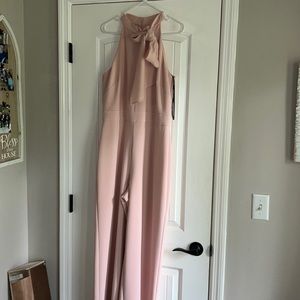 Pale pink dressy jumpsuit with ribbon tie neck